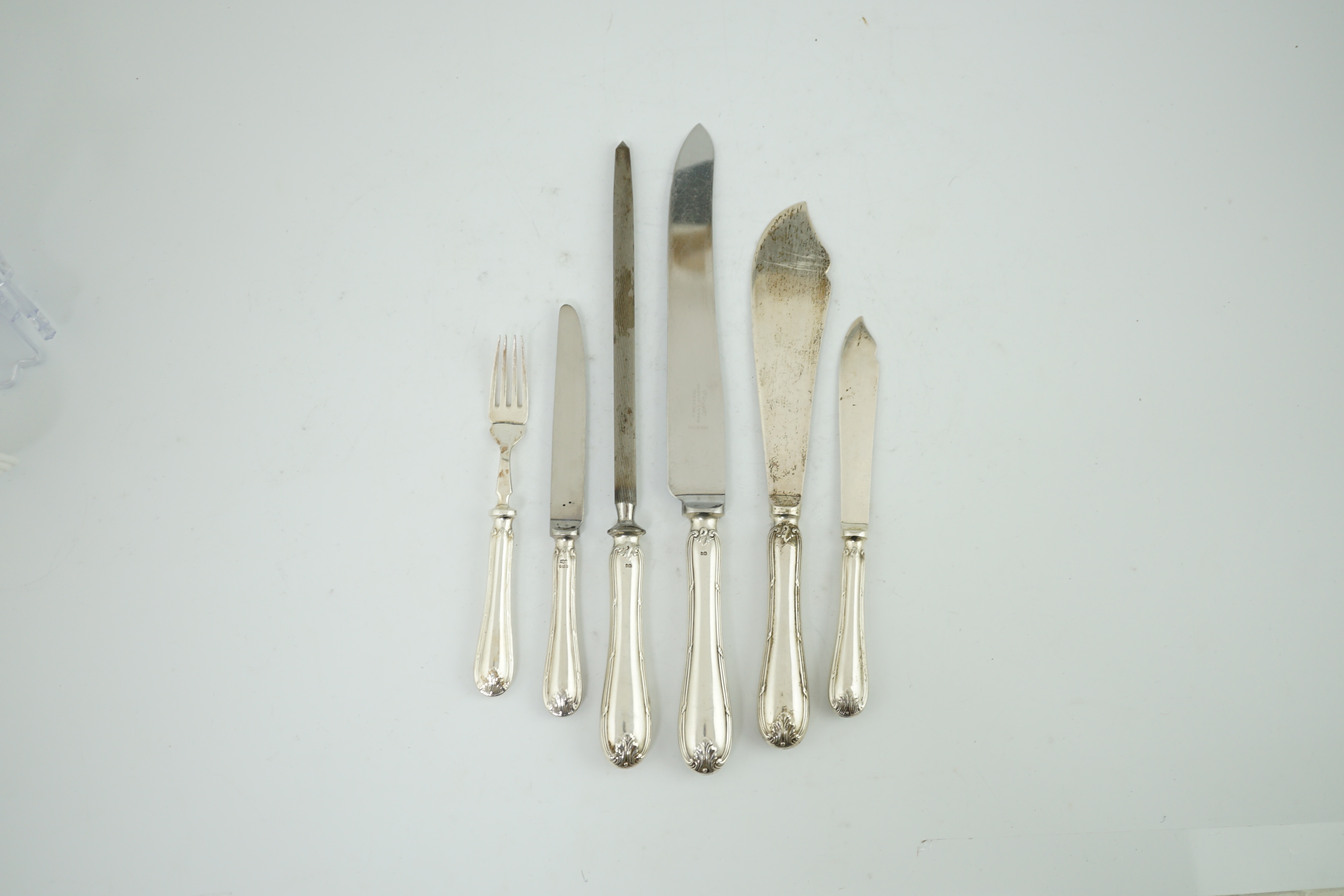 A modern part canteen of silver cutlery, comprising eight pairs of silver fish eaters, pair of fish servers, eight silver handled steel table knives and eight dessert knives and a three piece carving set